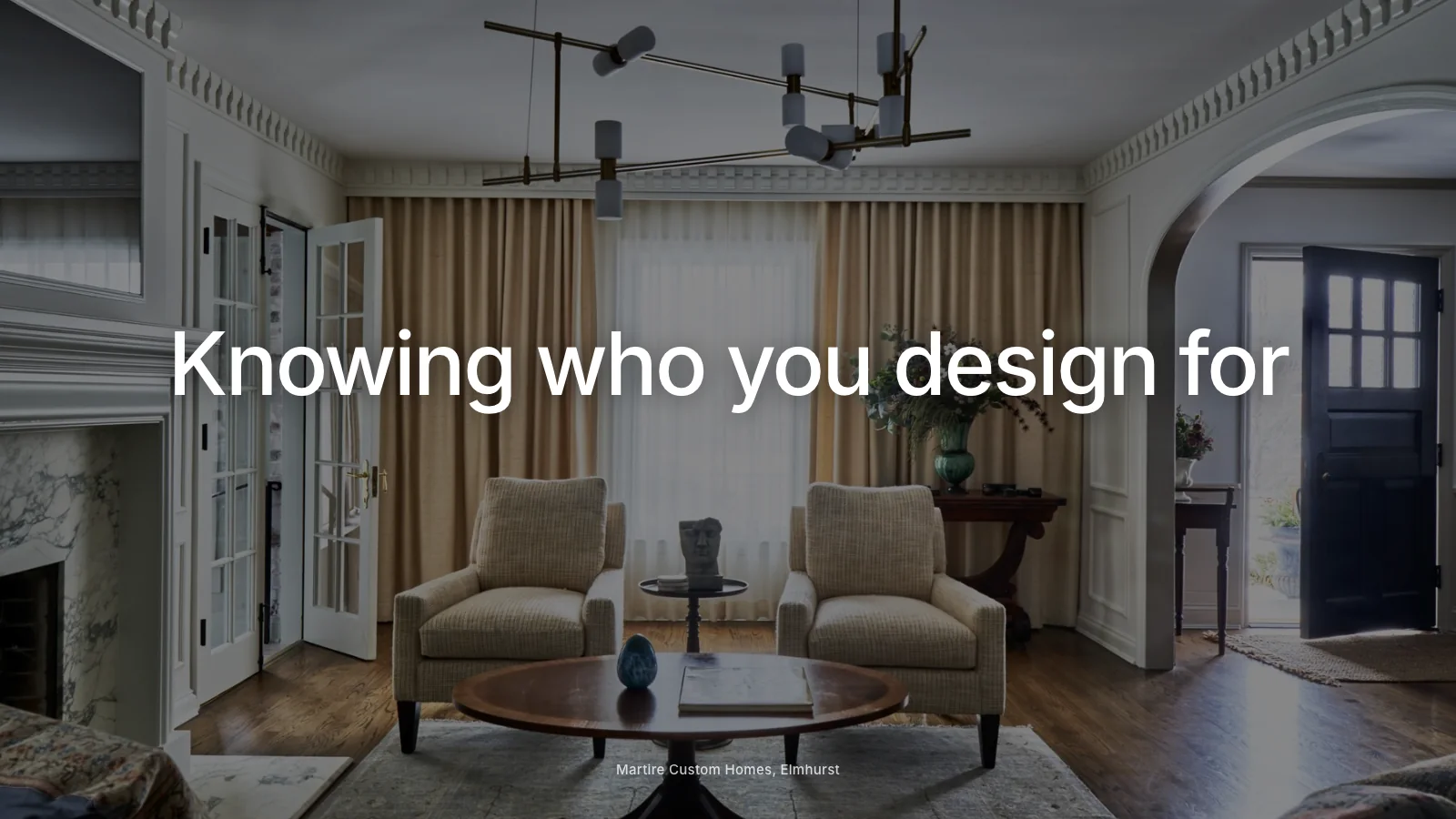 Architect sketching notes about ideal clients beside a portfolio