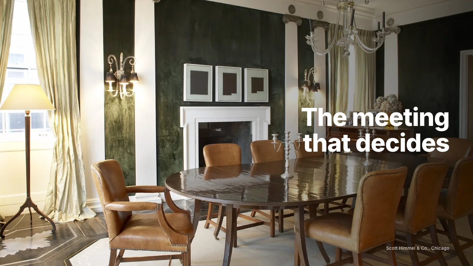 Interior designer leading a consultation with clients at their dining table