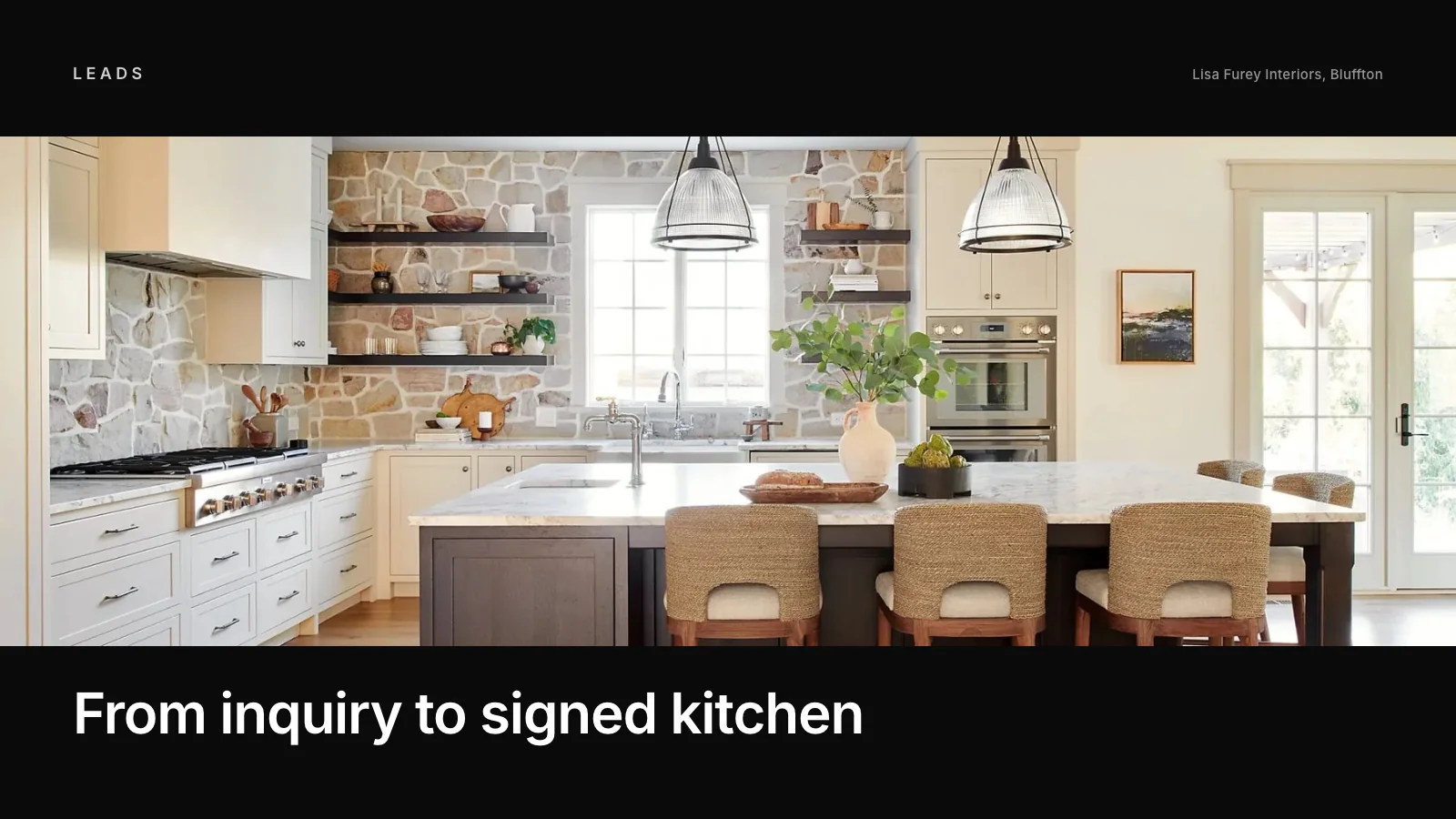 Remodeler reviewing kitchen plans with homeowners at their dining table