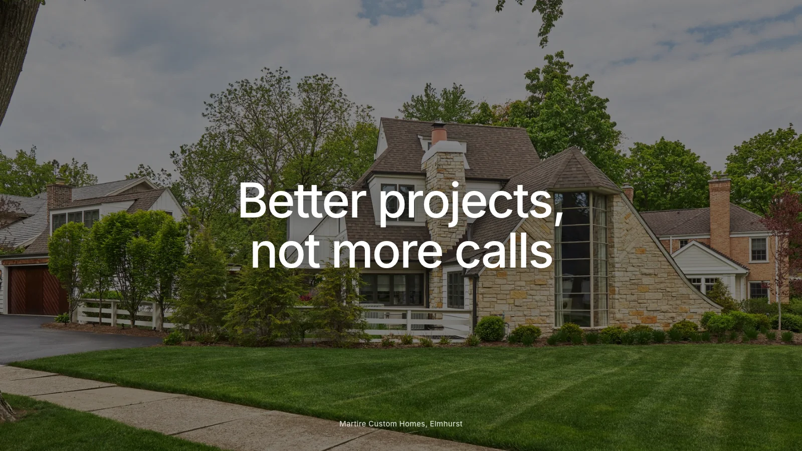 Custom home builder reviewing project leads beside a framed new construction home