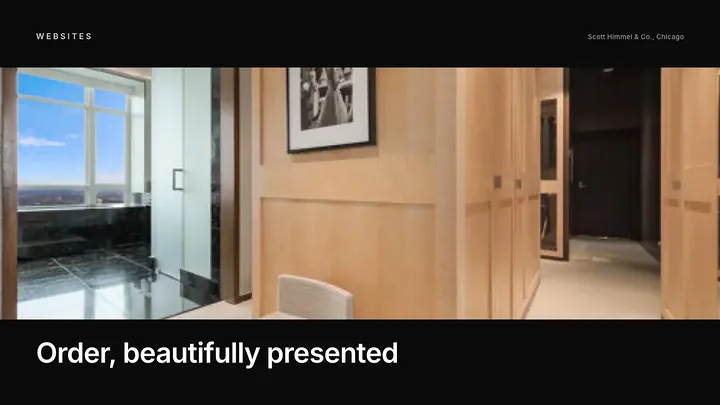 Custom walk-in closet with lighting and drawers shown on a closet design website